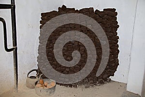 A stack of sods of peat turf to be used as fuel.