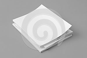 Stack of softcover magazines mockup on gray background