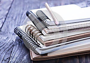 Stack of spiral notebooks