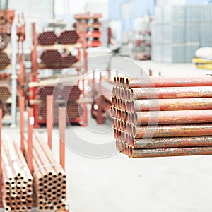 Stack of steel tubes in stock.