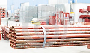 Stack of steel tubes in stock.