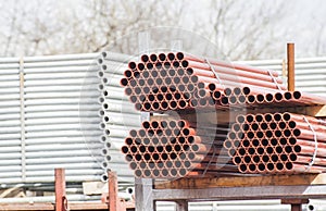 Stack of steel tubes in stock.