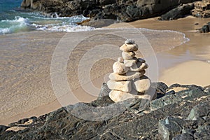 Stack of stones in balance at a beach