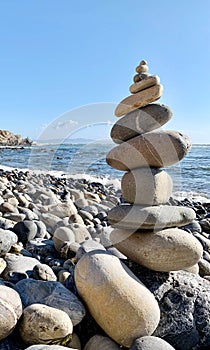 stack of stones on beach.Meditation with the stone tower on the sea shore