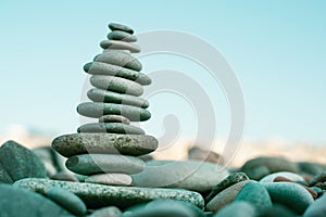Stack of stones on beach - nature background. Concept balance