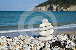 Stack of stones on the beach in summer.