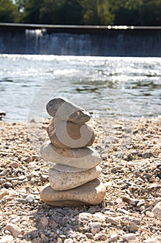 A stack of stones near the water