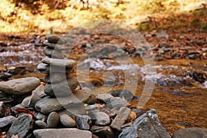Stack of stones near water.