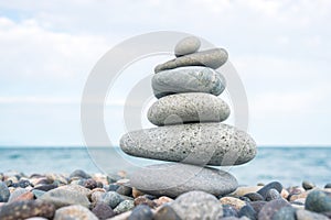 Stack of stones on the sea beach, stone balance