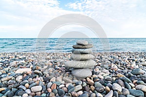 Stack of stones on the sea beach, stone balance