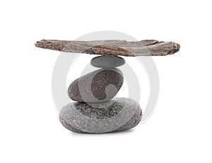 Stack of stones with tree branch on white background. Harmony and balance concept