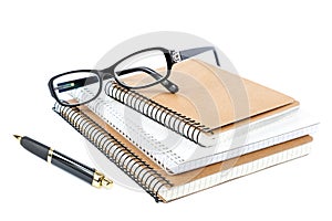 Stack stylish notebook, pen and glasses.
