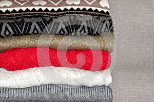 A stack of sweaters, jumpers.