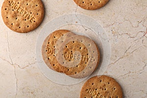 Stack of sweetmeal digestive biscuits closeup of a pile of biscuits on a texture background