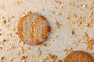 Stack of sweetmeal digestive biscuits closeup of a pile of biscuits on a texture background photo