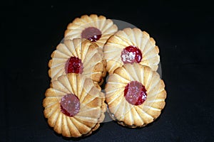 Stack of sweetmeal digestive biscuits isolated on black background