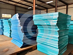 Stack of tack plastic sheets are kept in the warehouse. acrylic glass, building materials storage