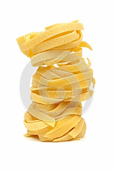 Stack of tagliatelle pasta nests photo