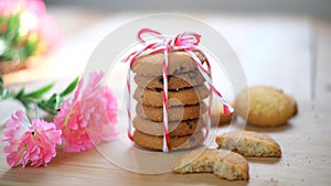 Stack of tasty choc chip cookies on wooden table