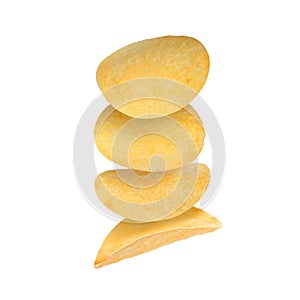 Stack of tasty potato chips falling on white background