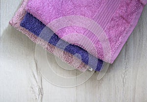 Stack of terry face towels, home textile, pink towel photo