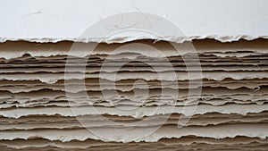 Stack of Textured Paper with Rough Deckled Edges