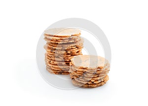 Stack of thin round crispbreads with herbs isolated on white