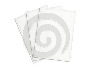 Stack of three blank white sheets of paper