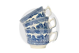 A stack of three blue and white china cups.