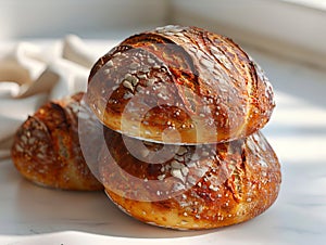 A stack of three breads on a table