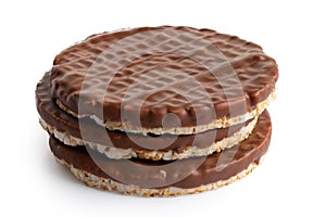 Stack of three chocolate rice cakes isolated on white.