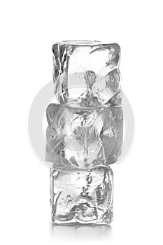 Stack of three ice cubes on white background