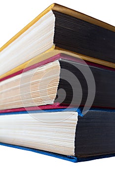 Stack of three old books isolated on white background