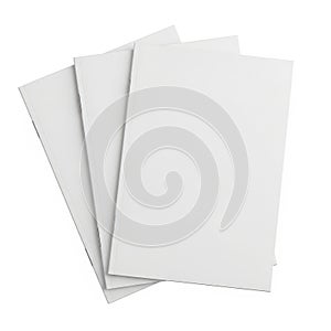 Stack of three plain white sheets of paper against a light background
