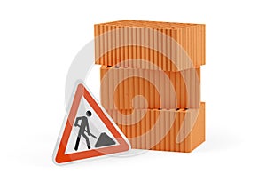 Stack of three red brick stones with two single bricks in front and road construction sign over white background, architecture,