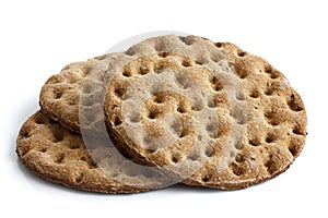 Stack of three round rye crispbreads isolated on white.