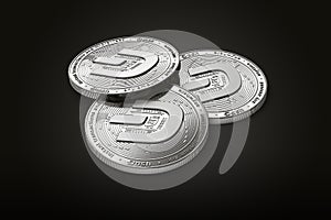 Stack of three silver Dash coins with 2019 logo update, isolated on black background. 3D rendering