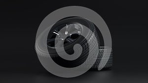 Stack of tires on Black Studio. Tires service. Car tire set.