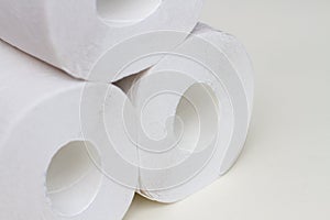 Stack of toilet paper rolls on white background