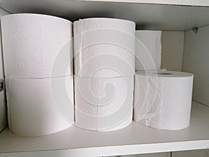 Stack of toilet paper in a shelf