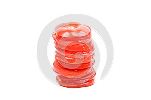 Stack of tomato slices on white background