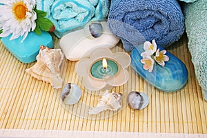 Towels, soaps, flowers, candles