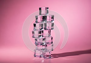 Stack of transparent ice cubes on pink background with shadow