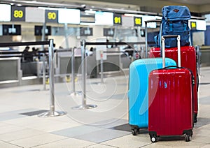 Stack of travelers luggage in airport terminal