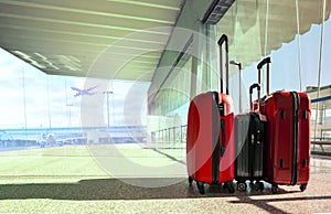 stack of traveling luggage in airport terminal and passenger plane flying for air transport and treveling theme photo