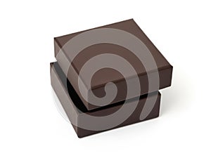 Stack of two brown cardboard boxes on white surface