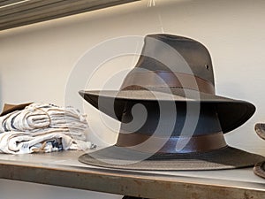 Stack of two fedora hats on display in department store clothes section photo