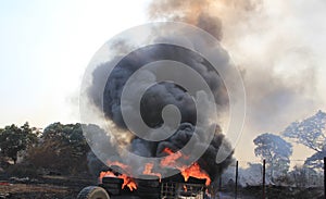 A stack of tyres on fire