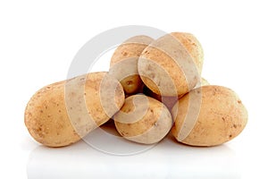 Stack of unpeeled potatoes photo