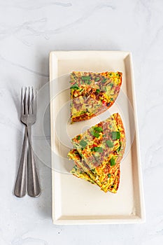 Stack up Slices of Frittata in a Platter Top Down Vertical Photo